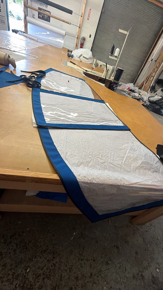 Clear vinyl enclosure panels being fabricated in the workshop