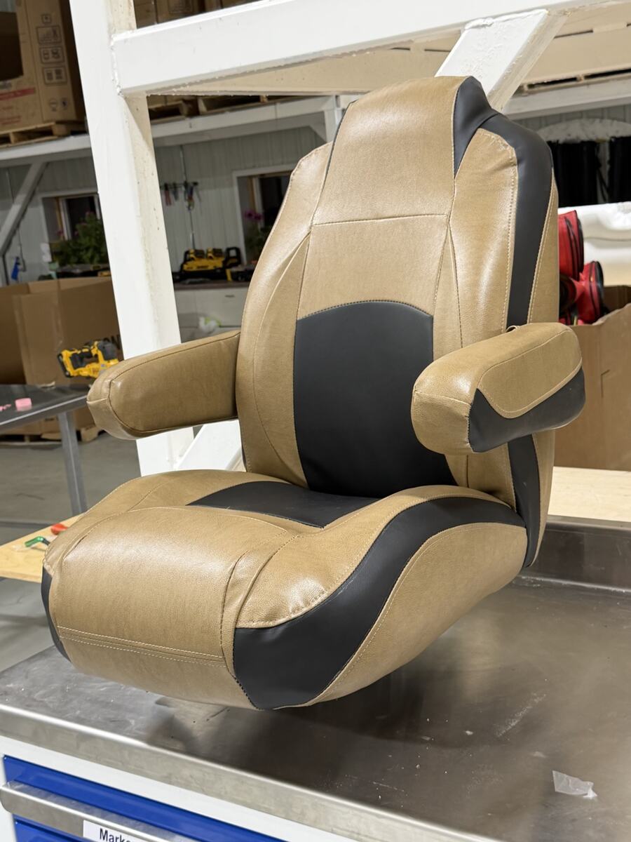 Restored captain chair with two-tone upholstery