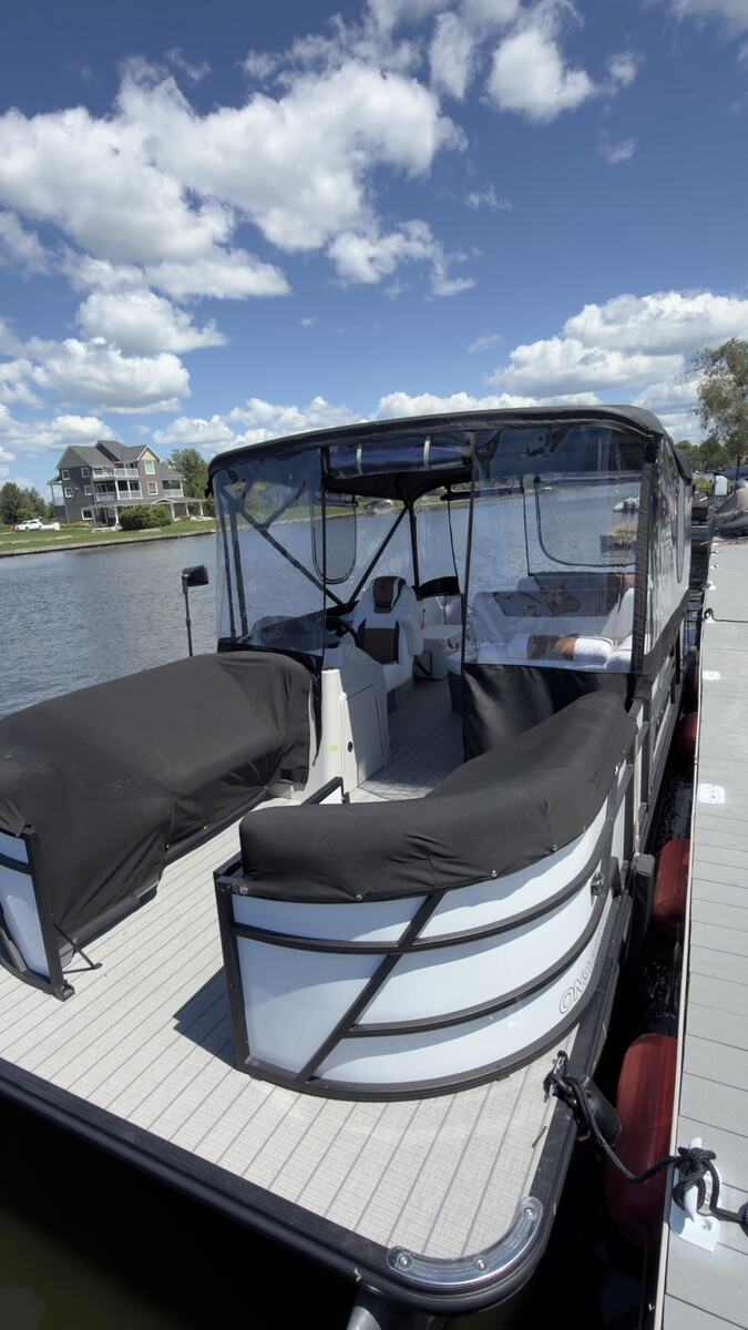 Custom black pontoon enclosure viewed from the front