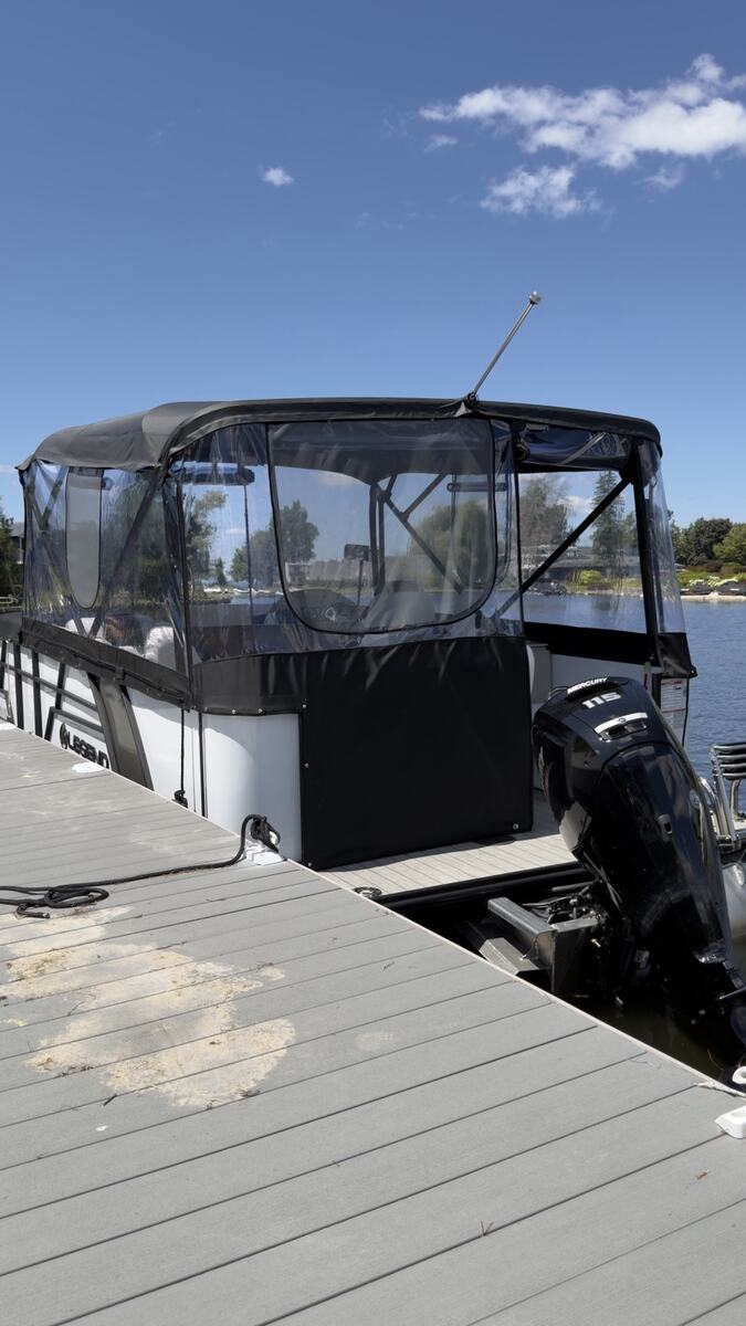 Rear view of a custom black pontoon enclosure